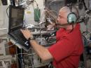 Astronaut Reid Wiseman, KF5LKT, operates Field Day from NA1SS. Wiseman and fellow astronaut Steve Swanson shaved their heads last week after losing a World Cup bet. [Photo courtesy of NASA]